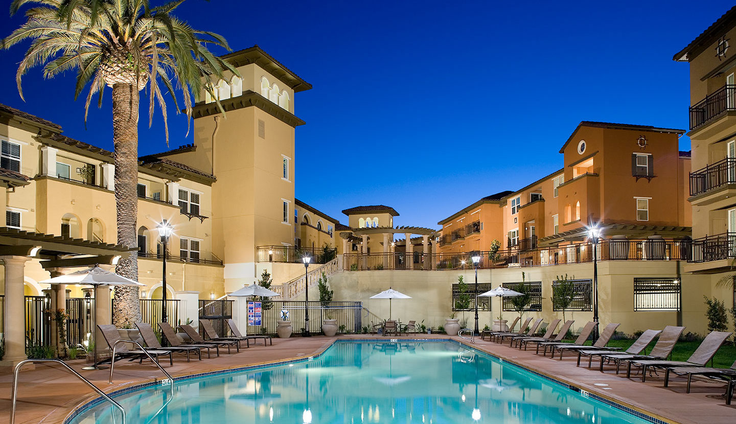 View of a common area pool in the evening