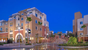 Front view of a multilevel apartment complex with several structures