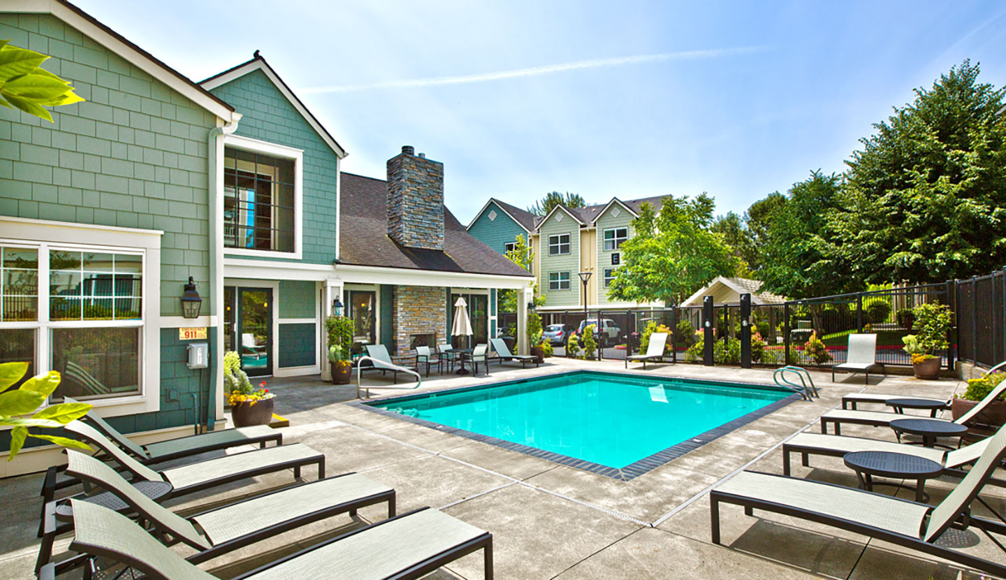 Community pool area with a clubhouse