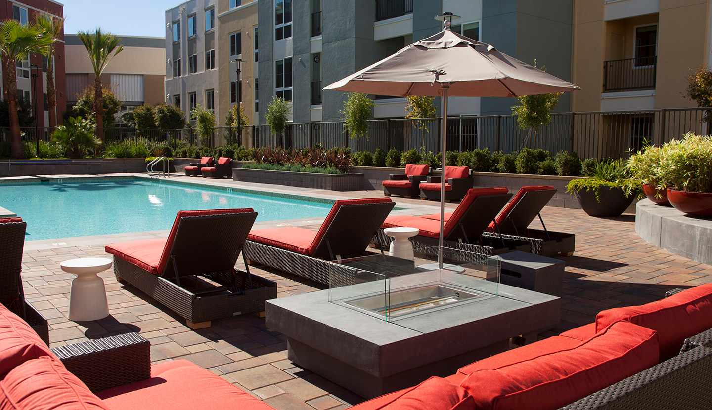 Close up of a seating area and fire pit of the apartment complex