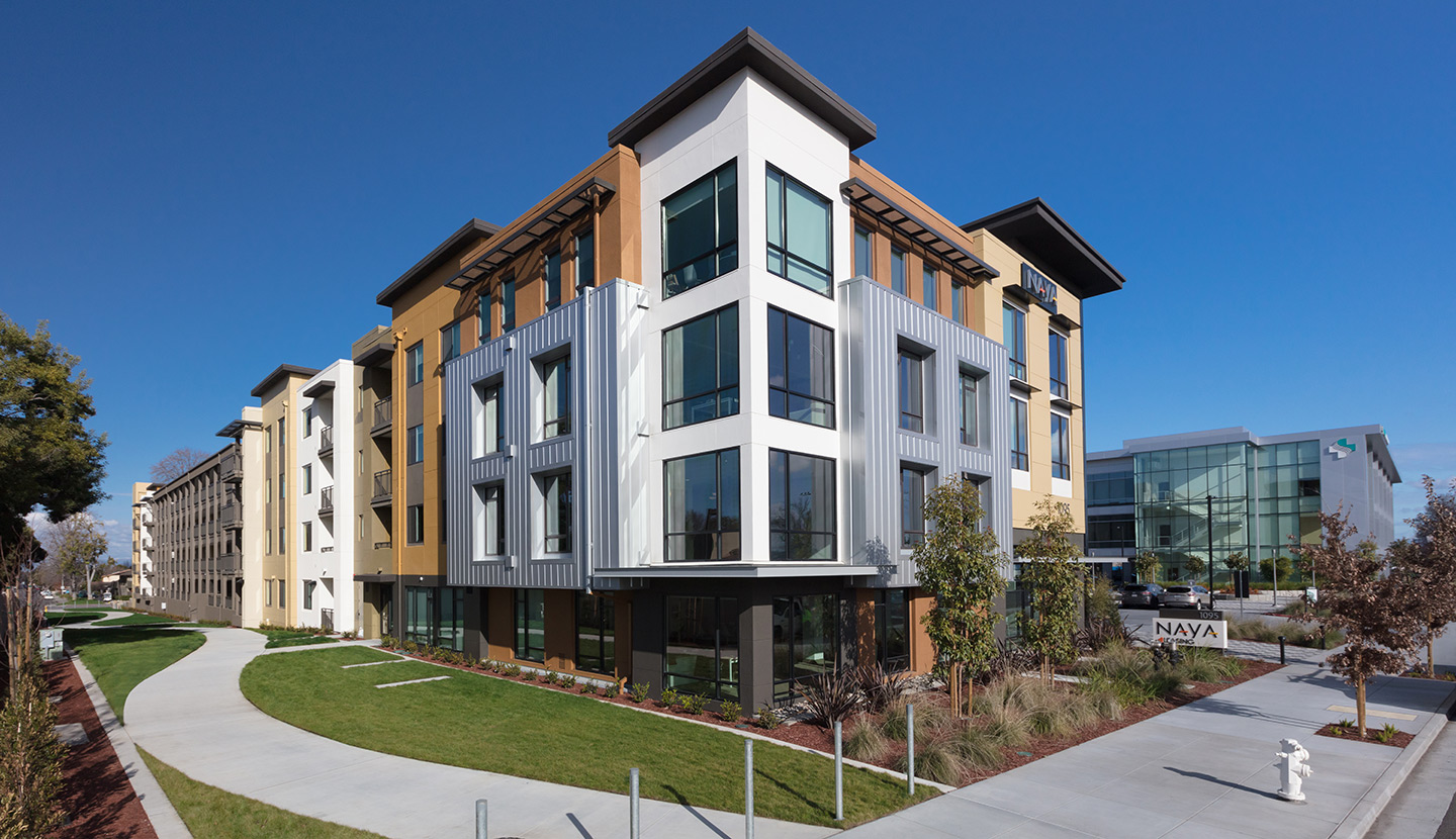 Exterior view of a three level apartment building