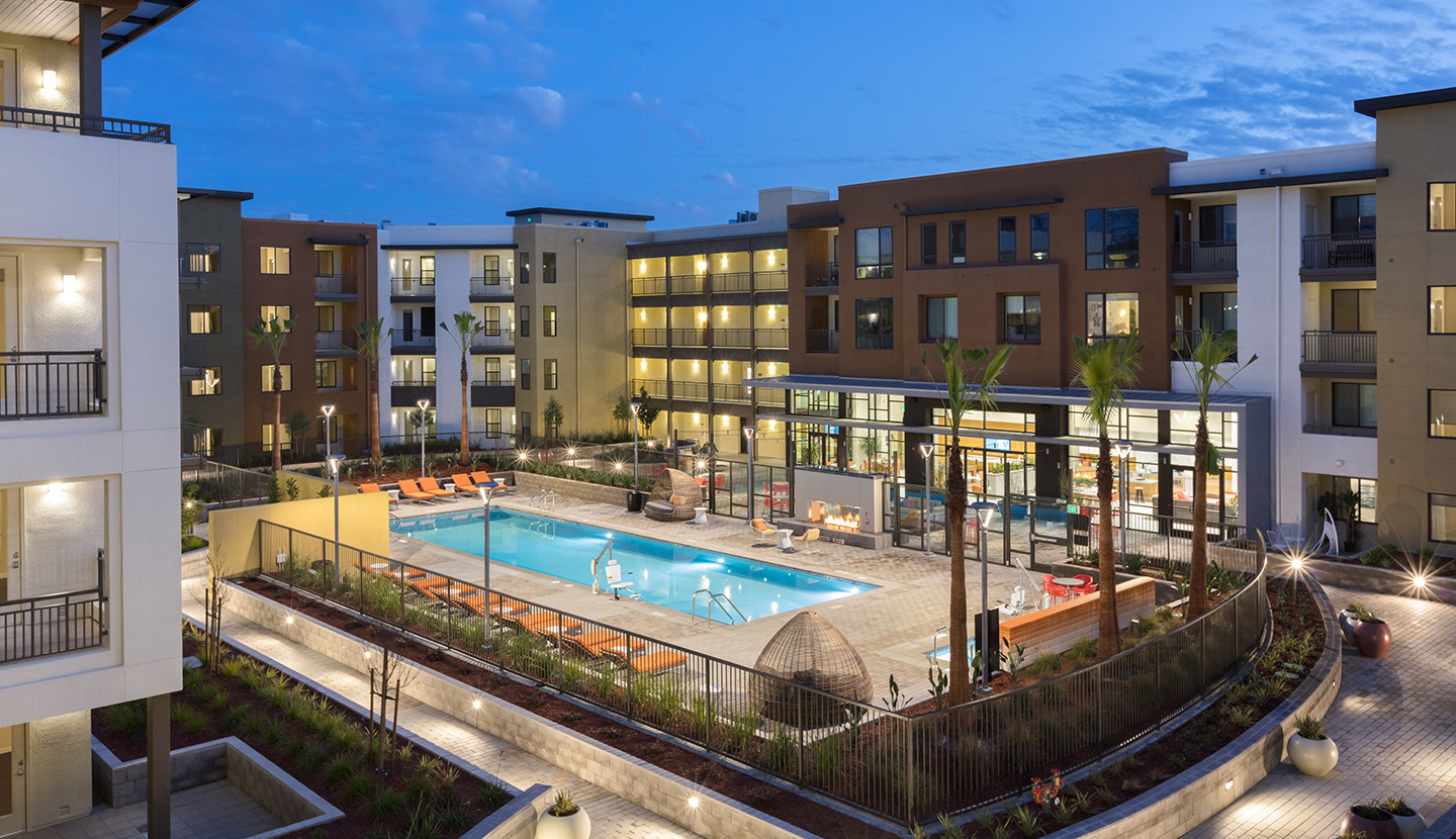 Pool area of apartment complex in the evening