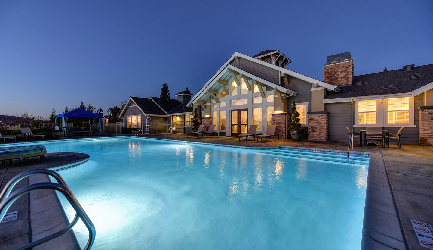 Pool in the evening with the clubhouse in the back