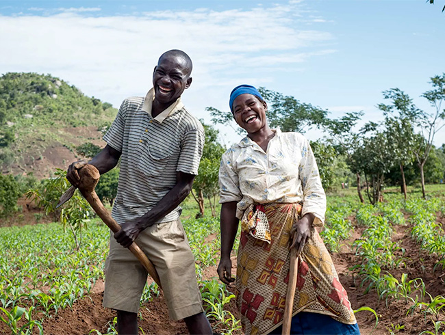 two farmers laughing