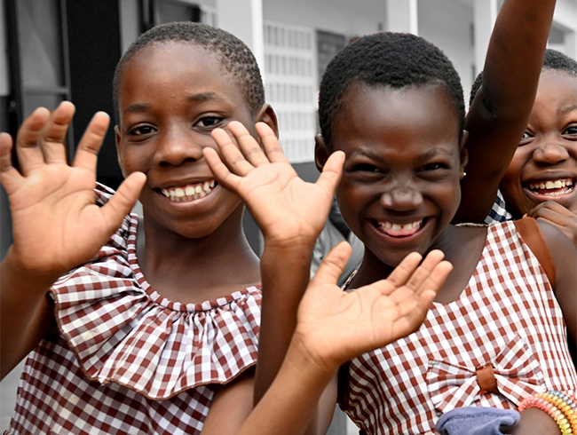 girls waving