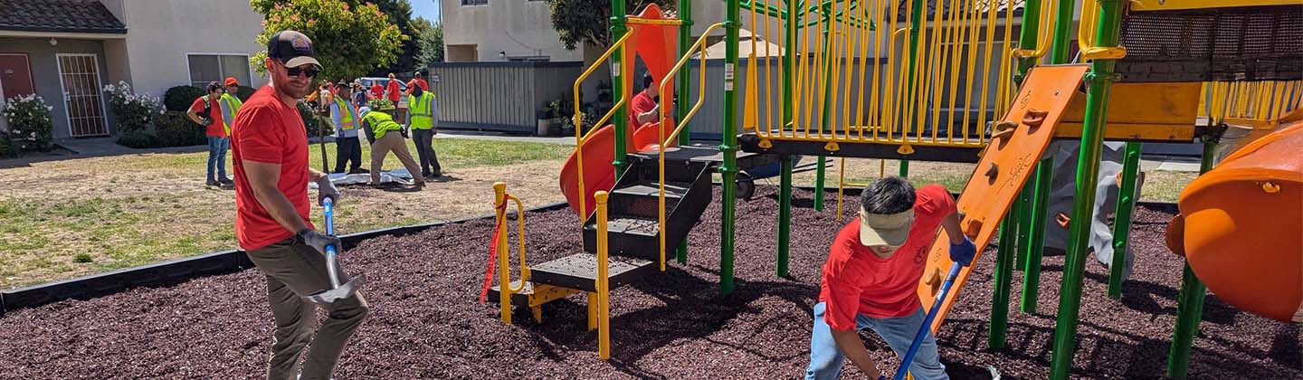 people working on a playground